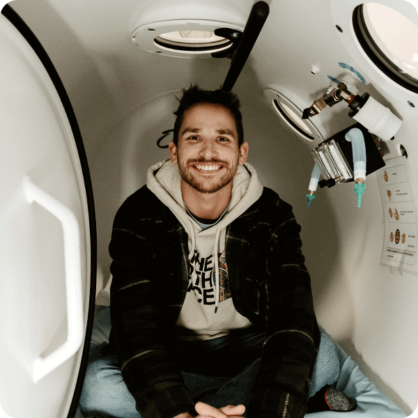 Patient smiling inside the hyperbaric chamber