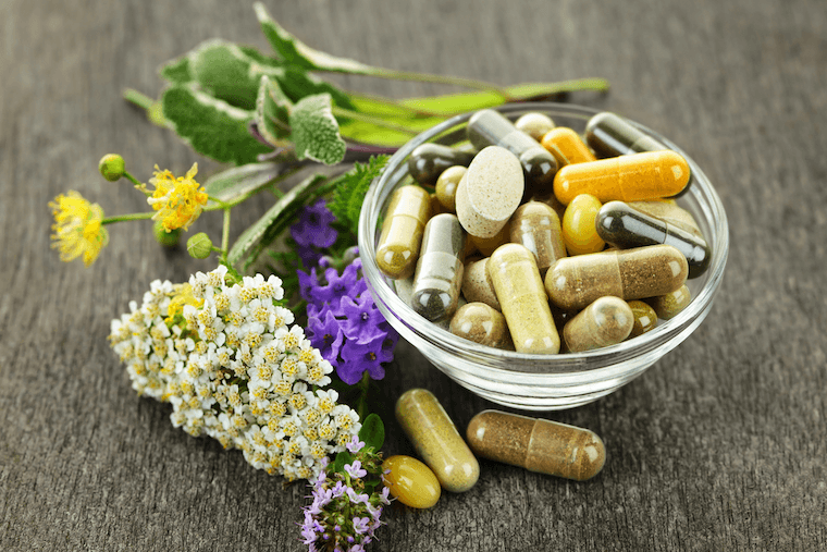 A variety of natural supplements alongside herbs.